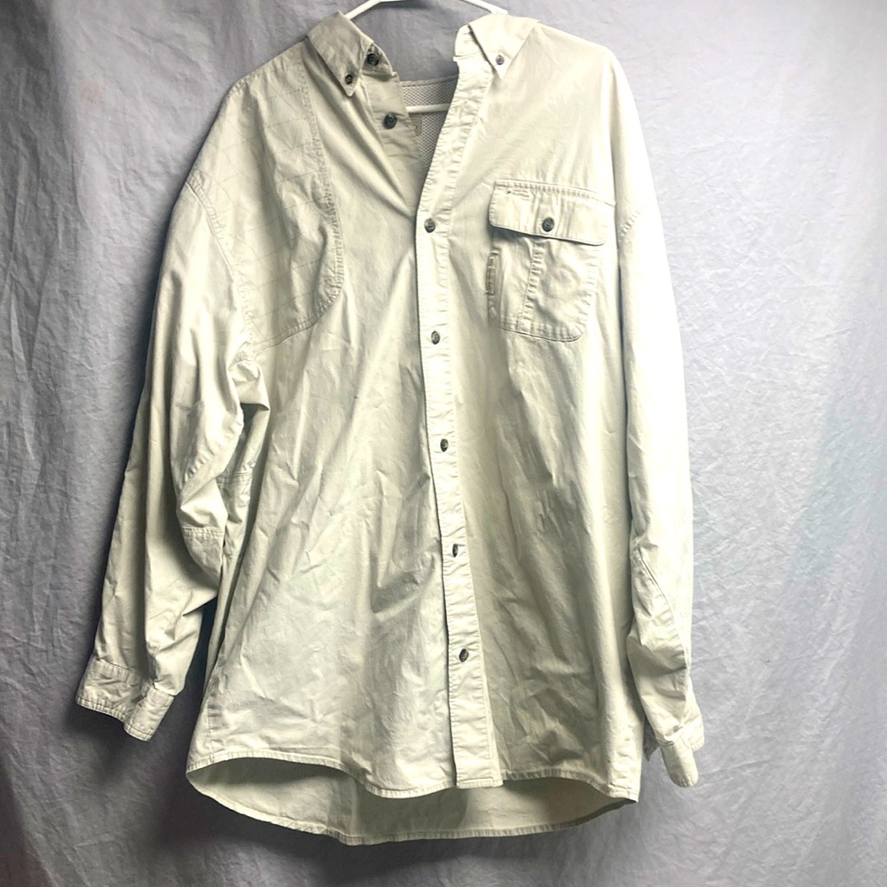This is a long sleeved khaki shirt by Columbia sportswear company.